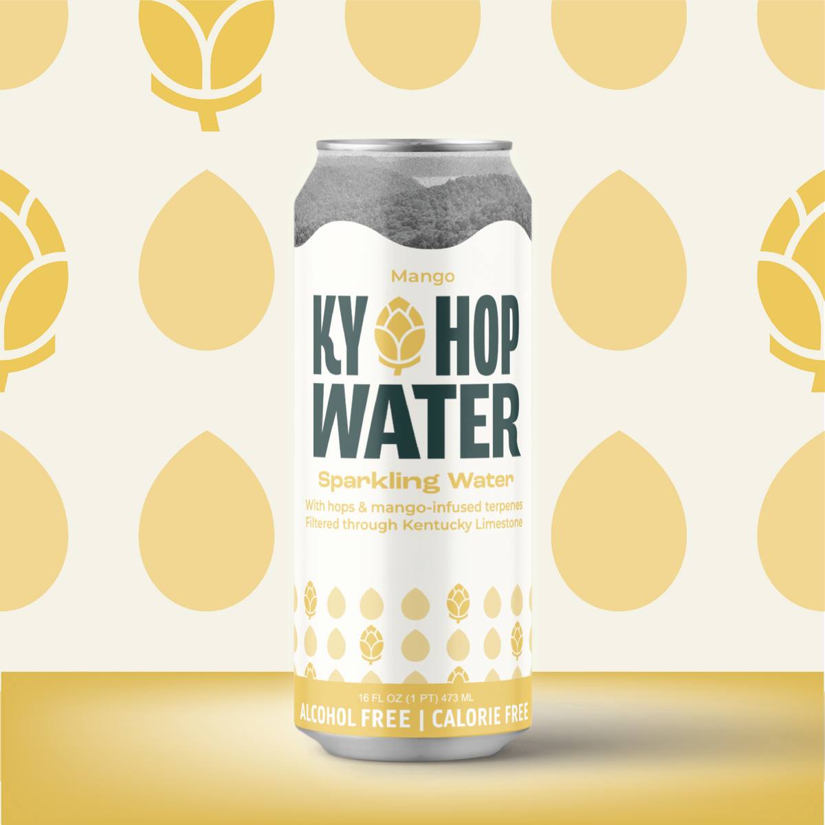 A single can of Ky Hop Water Sparkling Water in Mango flavor, featuring a white label with dark green and gold text and hop illustrations, set against a patterned cream and gold background.